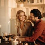 A serene romantic dinner setting with a couple enjoying candlelight, wine, and happiness.